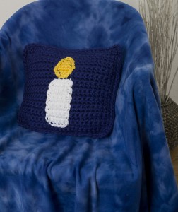 One of Lindsey's designs from Crochet 1-2-3, the Chanukah Candle Pillow.  (c) Valu-Publishing.