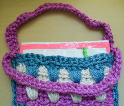 Striped Bag with No-Sew Liner, free crochet pattern and tutorial by Underground Crafter | Crochet bags are perfect projects to make and use right away year round! This pattern includes a photo tutorial for the special stitches and links to a photo tutorial for making a no-sew liner.