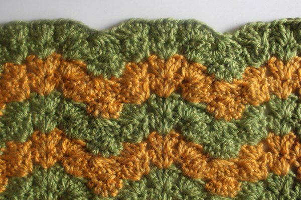 Triplet Ripple Baby Blanket, free crochet pattern with video tutorial in Lion Brand Heartland yarn by Underground Crafter | Trios of increases make a stunning ripple blanket with wide, gently curved peaks and deep, pointy valleys.