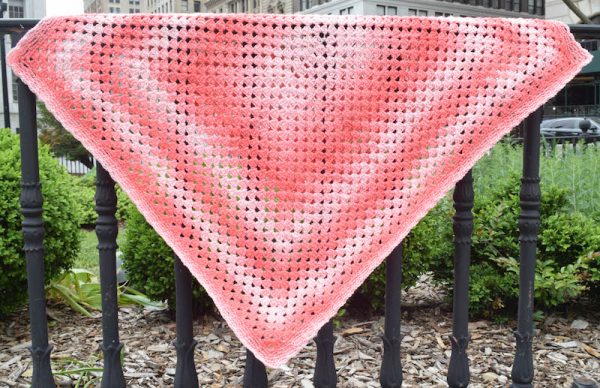 Simple Rectangular Granny Blanket, free crochet pattern in Red Heart Super Saver Ombré yarn by Underground Crafter | This rectangular variation on the traditional granny square pattern can easily be adjusted to your preferred size. A simple chain space border adds a finishing touch. Use a self-striping ombré yarn to create beautiful color changes without having to weave in ends.