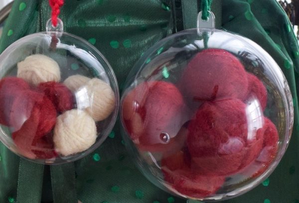 Simple Yarn Decorations by Underground Crafter The DIY Felted Balls Ornaments and the Crochet Button Garland are two simple, beginner-friendly projects that add a bit of handmade cheer to your holiday decorations.