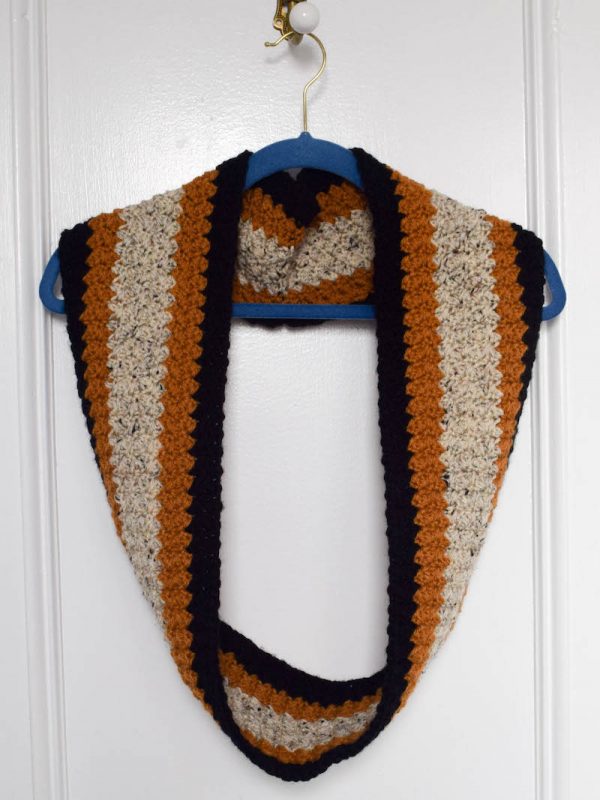 Free crochet pattern: Vintage Infinity Scarf in Lion Brand Vanna's Choice by Underground Crafter | A simple stitch pattern and a retro color combination create a cozy, unisex scarf that can be worn straight or seamed into an infinity scarf.