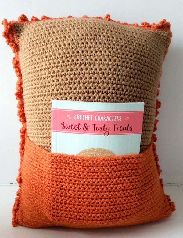 Free crochet pattern: Lion Pocket Pillow in Red Heart Super Saver yarn and stuffed with Fairfield Original Poly-Fil by Underground Crafter. This pattern is one of 10 free crochet patterns by 10 designers in the 2018 Softie Crochet Along with CAL Central