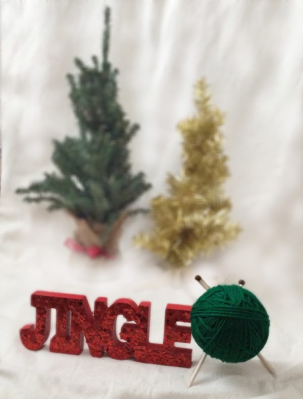 How To Make a Handmade Yarn with Knitting Needles Ornament with Hot Glue - tutorial by Underground Crafter - finished project styled with artifical trees and jingle sign