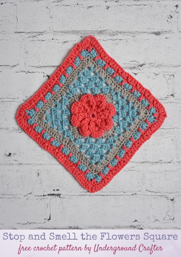 Stop and Smell the Flowers Square free crochet pattern by Underground Crafter - floral granny square on faux white brick background