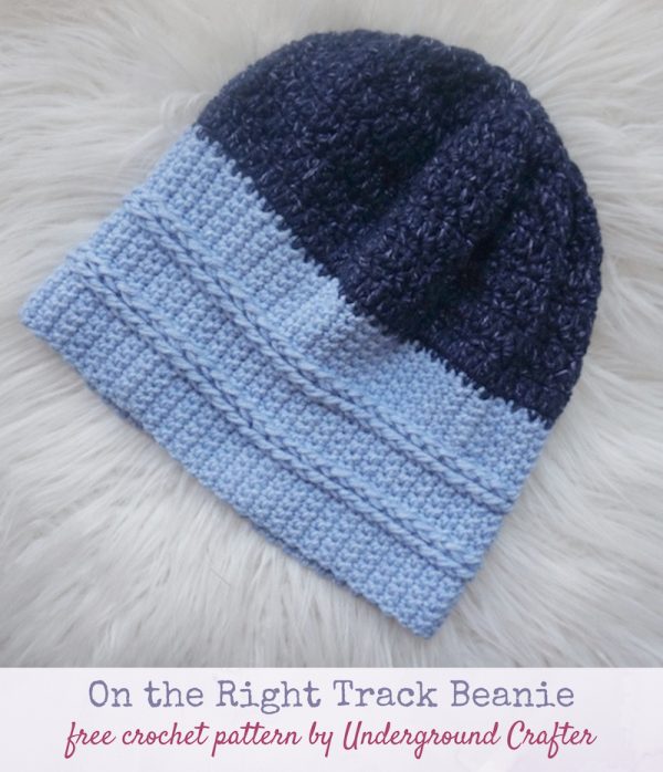 Free crochet pattern: On the Right Tracks Beanie in Lion Brand Jeans yarn by Underground Crafter - blue striped crochet hat on white, faux fur background